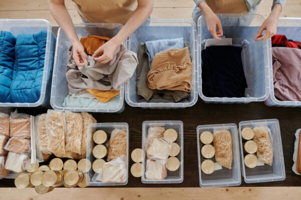 Hands putting together food kits